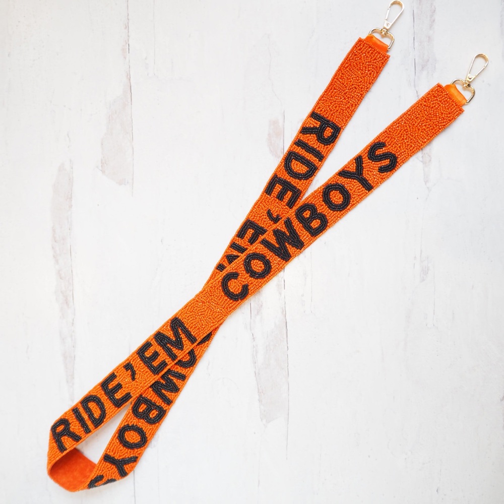 Collegiate game day Ride ‘Em Cowboys purse strap. Orange.